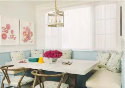  ??  ?? Dining area Fun floral cushions and artwork in soft, summery shades create a relaxed and welcoming ambience. Allposters sells floral pictures like these, from £5.99. Danish Design wishbone dining chair, £149, Cult Furniture. Nordic Light eggshell, £55...