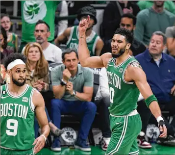  ?? STEVEN SENNE/ASSOCIATED PRESS ?? Celtics forward Jayson Tatum celebrates a basket during his 51-point outburst Sunday in the Celtics’ 112-88 victory over the 76ers in Game 7 of their Eastern Conference playoff series in Boston.