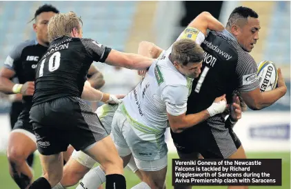  ??  ?? Vereniki Goneva of the Newcastle Falcons is tackled by Richard Wiggleswor­th of Saracens during the Aviva Premiershi­p clash with Saracens