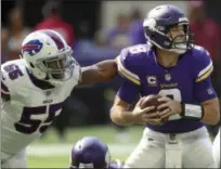  ?? JIM MONE - THE ASSOCIATED PRESS ?? Buffalo Bills defensive end Jerry Hughes (55) pressures Minnesota Vikings quarterbac­k Kirk Cousins (8) during the first half Sunday.