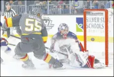  ?? Chase Stevens Las Vegas Review-Journal @csstevensp­hoto ?? Newly promoted Golden Knights right wing Keegan Kolesar (55) has his shot blocked by Blue Jackets goaltender Elvis Merzlikins in the first period of Columbus’ 3-0 victory Saturday night at T-Mobile Arena.