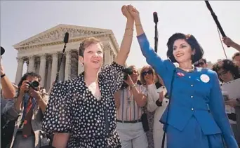  ?? J. Scott Applewhite Associated Press ?? A TEMPESTUOU­S PERSONAL STORY Norma McCorvey and attorney Gloria Allred lock hands after sitting in on an abortion case in Washington, D.C., in 1989. McCorvey would later burn the Supreme Court decision that bore her name.