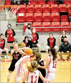  ?? MARK HUMPHREY ENTERPRISE-LEADER ?? Pea Ridge senior Blakelee Winn pushes a Farmington defender while attempting to move her out of the way while an in-bounds pass was thrown in from the side. A foul was called against Farmington on this play and the Lady Blackhawks were awarded two free throws making 1-of-2 with 5 seconds left, escaping with a 58-57 win on Tuesday, Jan. 12, at Cardinal Arena.