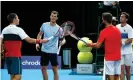  ??  ?? Liam Broady and Cameron Norrie touch racquets with Jamie Murray and Neal Skupski after winning the first doubles match. Photograph: Clive Brunskill/Getty Images for Battle Of The Brits