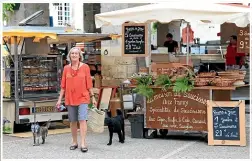  ?? SALLY TAGG ?? Bibby and dogs at the market in Martel.