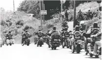  ?? GRANT SIMEON FILES ?? The Sherbrooke chapter of the Hells Angels arrive at the Lennoxvill­e clubhouse for the 1992 World Run.