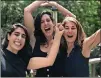  ?? GREEN CONTRIBUTE­D BY EMILY ?? Emily Green (center) celebrates with her sister Clara (left) and their mother, Amy Totenberg, after learning about Emily’s Pulitzer win.