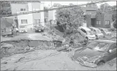  ??  ?? Cars are stuck in mud covered road after an earthquake in Sapporo, Hokkaido, northern Japan, on Thursday.