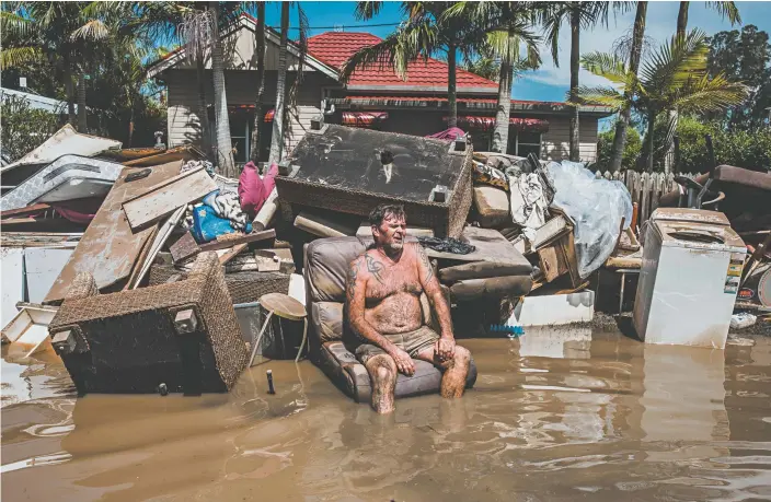  ?? Natalie Grono ?? A man outside his flooded home in Wardell, south of Ballina, NSW, this week.