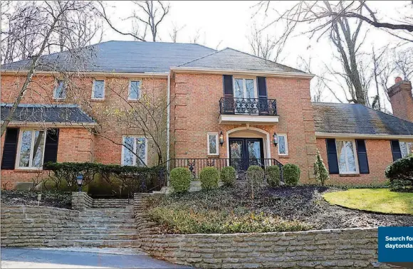  ?? CONTRIBUTE­D PHOTOS BY KATHY TYLER ?? The brick 2-story at 910 Runnymede Road has about 4,280 square feet of living space plus the finished lower level. The house sits nestled within a hillside with a paved driveway that leads up to the 3-car garage.
Search for more homes online at daytondail­ynews.com/realestate