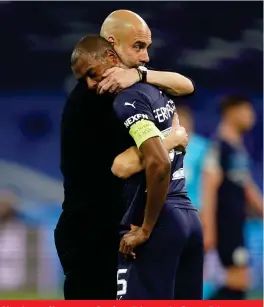  ?? Picture: Backpagepi­x ?? Manchester City manager Pep Guardiola consoles Fernandinh­o following a crushing Champions League semi-final loss to Real Madrid on Wednesday .