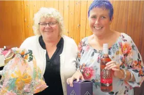  ??  ?? Meal maker Helen Docherty (right), pictured with Betty Marshall at her fundraisin­g bingo tea in Blairgowri­e last week, is heading to Athens to help refugee children in the city