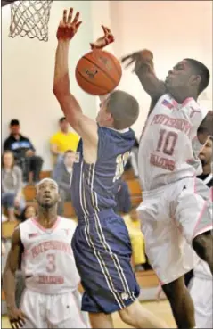  ?? Kevin Hoffman/the Mercury ?? Pottsgrove’s Mike Fowler blocks a shot by Spring-Ford’s Josh Tupper during Saturday’s game.