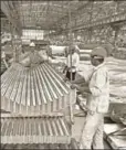  ?? BLOOMBERG ?? ■ Employees at a factory producing steel products, Maharashtr­a (File)
