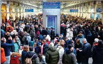  ?? ?? Marooned: Thousands of bewildered passengers at St Pancras Station in London as Eurostar cancels all trains to Paris after flooding closed the main tunnel to France