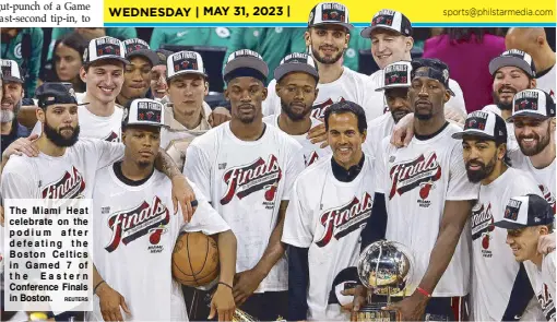  ?? REUTERS ?? The Miami Heat celebrate on the podium after defeating the Boston Celtics in Gamed 7 of the Eastern Conference Finals in Boston.