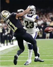  ?? GERaLD HERBERT/THE ASSOCIATED PRESS FILE ?? A blatant pass interferen­ce by the Rams’ Nickell Robey-Coleman on Saints receiver Tommylee Lewis during the NFC Championsh­ip set the stage for possible rule changes.
