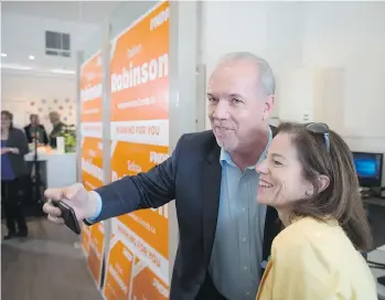  ?? DARRYL DYCK/THE CANADIAN PRESS ?? B.C.’s Minister of Municipal Affairs and Housing Selina Robinson, seen with Premier John Horgan, says additional funding for the Residentia­l Tenancy Branch will help it operate better.