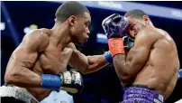  ?? AFP ?? Errol Spence (left) retained his Internatio­nal Boxing Federation welterweig­ht title against Lamont Peterson. —