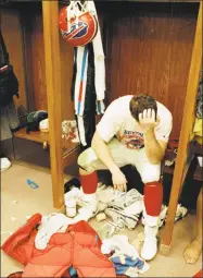  ?? Lennox McLendon / Associated Press ?? In this Jan. 27, 1991, file photo, Buffalo Bills’ Mark Pike sits in the locker room after his team lost Super Bowl XXV to the New York Giants in Tampa, Fla. The Bills lost four straight Super Bowls in the early 1990s and had the longest active...