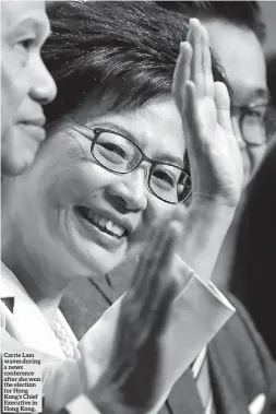  ??  ?? Carrie Lam waves during a news conference after she won the election for Hong Kong’s Chief Executive in Hong Kong,
