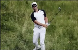  ?? THE ASSOCIATED PRESS ?? Paul Casey, of England, hits on the 14th hole during Friday’s second round of the U.S. Open.