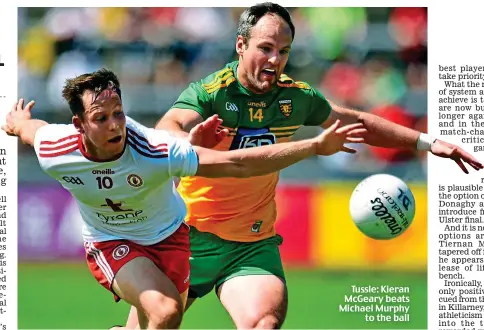  ??  ?? Tussle: Kieran McGeary beats Michael Murphy to the ball