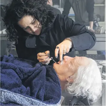  ?? PHOTO: NATIONAL GEOGRAPHIC ?? Artist at work . . . Queenstown­based makeup designer Davina Lamont turns actor Geoffrey Rush into Einstein behind the scenes of Genius, a National Geographic Channel drama, filmed in the Czech Republic.