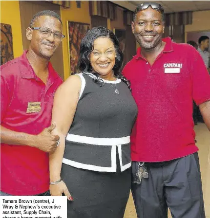  ??  ?? Tamara Brown (centre), J Wray &amp; Nephew’s executive assistant, Supply Chain, shares a happy moment with Kevin Richards (left) and Howard Nicholas, during a luncheon to recognise the company’s EHS volunteers at its Hospitalit­y Room, Spanish Town Road, recently.