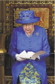  ?? Carl Court / Associated Press ?? Queen Elizabeth II gives a speech in the House of Lords at the opening of Parliament in London.