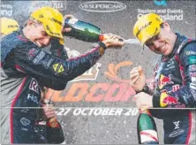  ??  ?? Warren Luff (left) and Craig Lowndes celebrate their victory in V8 Supercars action on the Gold Coast in style