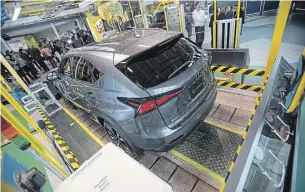  ?? GEOFF ROBINS THE CANADIAN PRESS FILE PHOTO ?? A Lexus NX300 in the Visitor Centre at an announceme­nt at the plant in Cambridge last year.