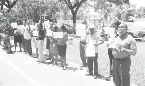  ??  ?? Teachers of the South Georgetown Branch of the Guyana Teachers’ Union (GTU) protest outside the Ministry of Finance yesterday.