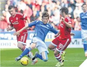  ??  ?? Murray Davidson (left) tackles Aberdeen’s Niall McGinn.