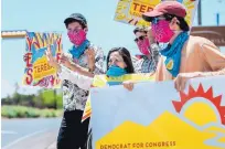  ?? EDDIE MOORE/JOURNAL ?? Teresa Leger Fernandez, the Democratic Party nominee in the 3rd Congressio­nal District, was joined by her sons Alisandro, Abelino and Dario near a polling place in Santa Fe on Tuesday.