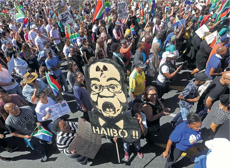  ?? Picture: ESA ALEXANDER ?? NO TO NUCLEAR: Demonstrat­ors in Cape Town gather around a huge Zuma-nuclear mask. There are fears that President Jacob Zuma will agree to lavish spending on nuclear power stations which were opposed by his sacked finance minister