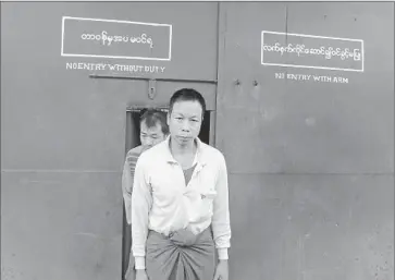  ?? AFP/Getty Images
AN UNIDENTIFI­ED political prisoner walks out of a prison in Kalay, Myanmar, after his release. The government of Myanmar, also known as Burma, has pledged to free all political detainees by the end of the year. ??