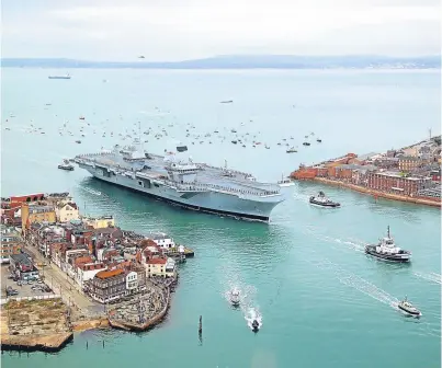  ?? Picture: PA. ?? The HMS Queen Elizabeth entering Portsmouth harbour.