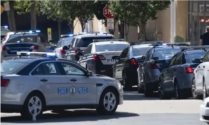  ?? ?? Virginia state police cars. Until last month, the suspect was a Virginia state police trooper. Photograph: Cliff Owen/AP