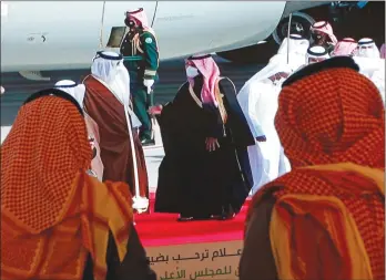  ??  ?? The Associated Press
Saudi Crown Prince Mohammed bin Salman, centre right, greets the Emir of Qatar Sheikh Tamim bin Hamad Al Thani, as he arrives at Al Ula airport to attend the 41st Gulf Cooperatio­n Council in Saudi Arabia, on Tuesday. Al Thani's arrival in the ancient desert city was broadcast live on Saudi TV.