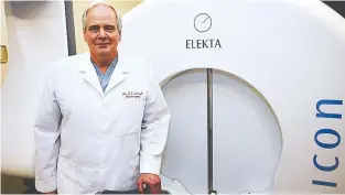  ??  ?? Neurosurge­on Dr. Keith Aronyk with the $17.2-million Gamma Knife, technology that allows surgeons to precisely aim beams of radiation to execute brain surgery in a scalpel-less, non-invasive procedure.