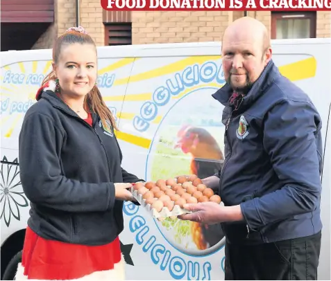  ??  ?? Generosity Young farmer Claire Strathern hands over some eggs