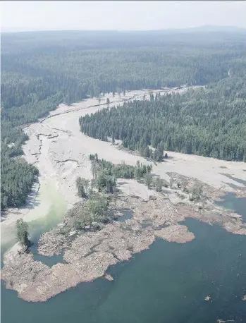  ?? THE CANADIAN PRESS/FILES ?? Contents from a tailings pond flow down Hazeltine Creek into Quesnel Lake near the town of Likely in 2014. The B.C. Conservati­on Officer Service continues to investigat­e the incident.