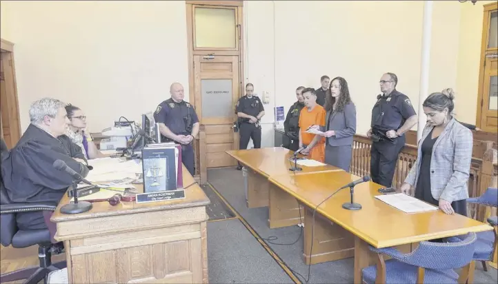  ?? Paul Buckowski / times union ?? Judge thomas marcelle, left, holds a bail hearing dec. 5, 2019, for Anthony ojeda, background center, who is accompanie­d by his attorney, Albany County Assistant Public defender Angela Kelley. Also appearing in court is Albany County Assistant district Attorney Shanza malik, far right.