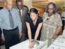  ?? FILE ?? Senior Director of Developmen­t Planning, Policy and Monitoring, Ministry of Economic Growth and Job Creation, Rollin Alveranga (left) along with (from second left) Executive Director of the HEART Trust/NTA, Dr Wayne Wesley, and Adviser to the Minister...