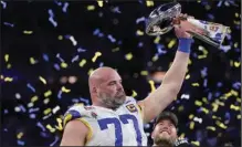  ?? (AP/Mark J. Terrill) ?? Los Angeles Rams offensive tackle Andrew Whitworth holds up the Lombardi Trophy after the Rams defeated the Cincinnati Bengals in Super Bowl LVI on Sunday in Inglewood, Calif. Whitworth is the first offensive lineman in his 40’s to play in the Super Bowl.