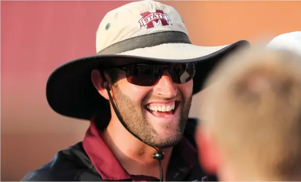  ?? (Photo by Austin Perryman, for Starkville Daily News) ?? Mississipp­i State men's tennis coach Matt Roberts smiles during a match against South Carolina earlier this season.