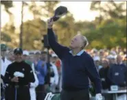  ?? CURTIS COMPTON — ATLANTA JOURNAL-CONSTITUTI­ON VIA AP ?? Jack Nicklaus tips his hat skyward in honor of the late Arnold Palmer, as Gary Player looks on before starting the first round of the Masters golf tournament in Augusta Ga., Thursday.