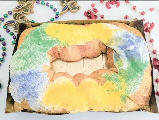  ?? REKAYA GIBSON/STAFF PHOTOS ?? The Fresh Market has king cakes from Gambino’s Bakery in New Orleans. (Beads not included.)