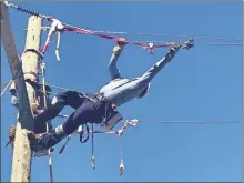  ?? GnTc ?? Salvador Barragan practices pulling wire as a student in GNTC’s Electrical Lineworker Program.